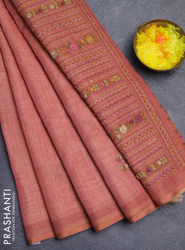 Linen cotton saree peach shade with embroidery buttas and zari woven border