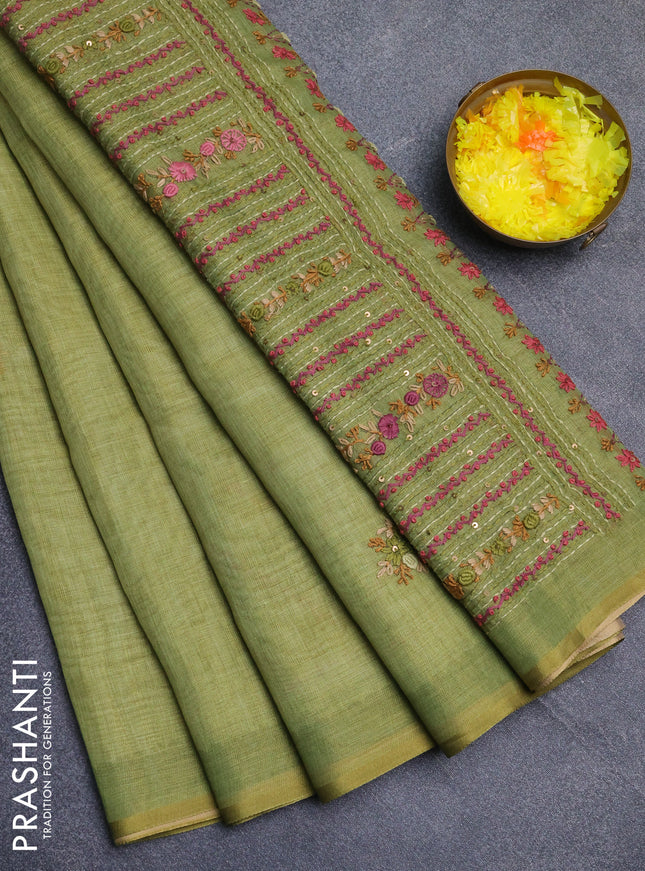 Linen cotton saree light green with embroidery buttas and zari woven border