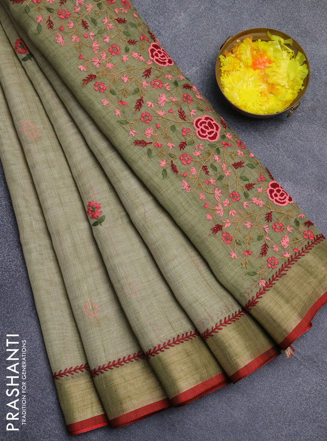 Linen cotton saree light green and red with embroidery buttas and zari woven border