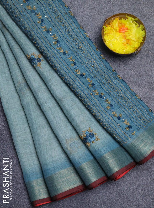 Linen cotton saree pastel blue and maroon with embroidery buttas and zari woven border
