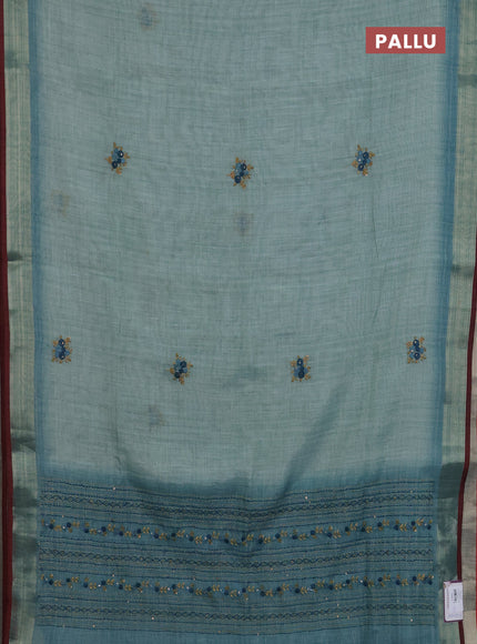 Linen cotton saree pastel blue and maroon with embroidery buttas and zari woven border