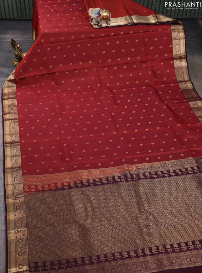 Kanchipuram silk saree rustic orange and wine shade with allover zari woven buttas and zari woven border