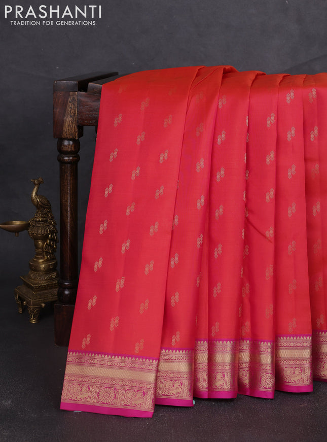 Kanchipuram silk saree pinkish orange and pink with allover zari woven buttas and zari woven border