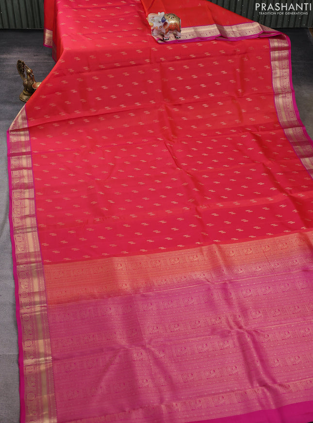 Kanchipuram silk saree pinkish orange and pink with allover zari woven buttas and zari woven border
