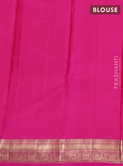 Kanchipuram silk saree pinkish orange and pink with allover zari woven buttas and zari woven border