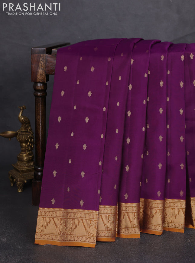 Kanchipuram silk saree purple shade and dark mustard with allover zari woven buttas and annam & temple zari woven border