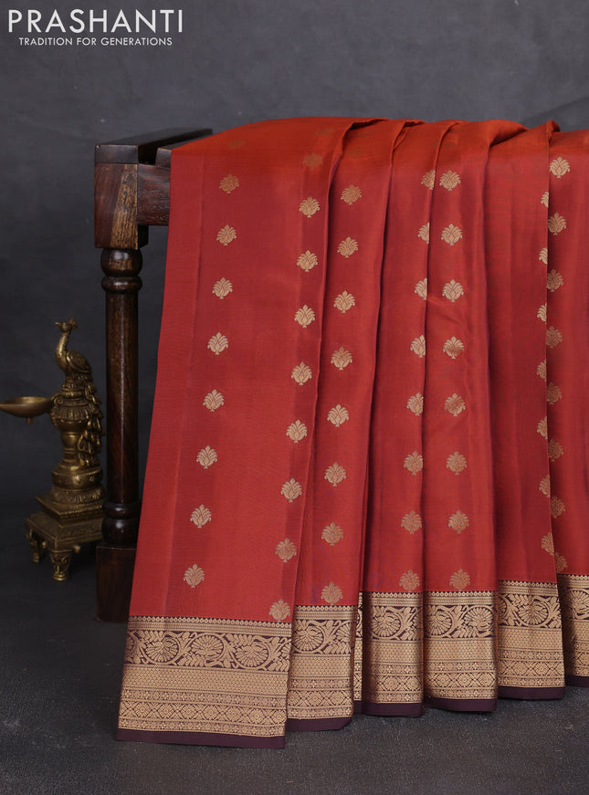 Kanchipuram silk saree rustic orange and coffee brown with allover zari woven buttas and zari woven border