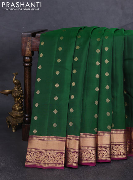 Kanchipuram silk saree bottle green and magenta pink with allover zari woven buttas and rich zari woven border