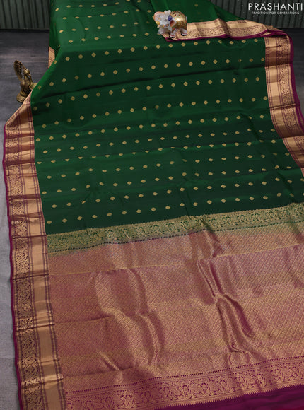 Kanchipuram silk saree bottle green and magenta pink with allover zari woven buttas and rich zari woven border