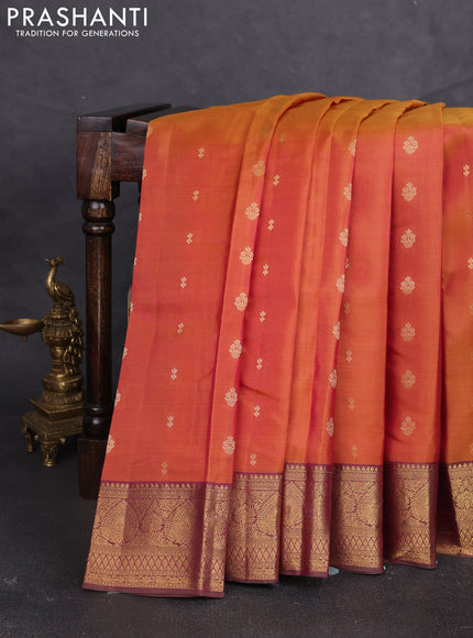 Kanchipuram silk saree dual shade of pinkish orange and dark mustard with allover zari woven buttas and zari woven border