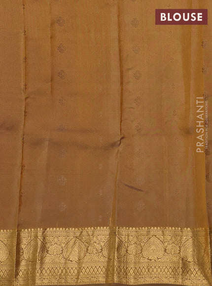 Kanchipuram silk saree dual shade of pinkish orange and dark mustard with allover zari woven buttas and zari woven border