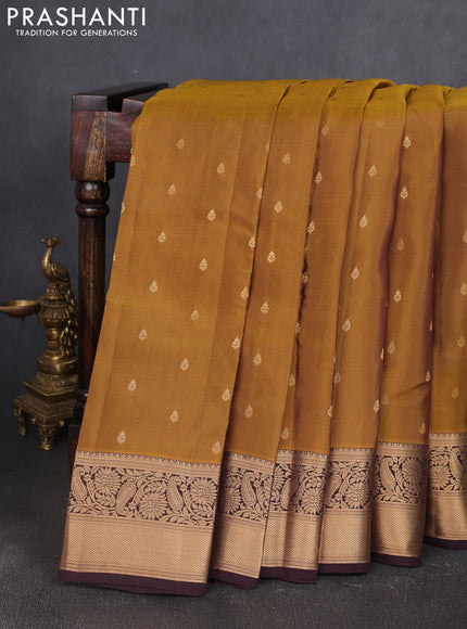 Kanchipuram silk saree dark mustard and coffee brown with allover zari woven buttas and zari woven border