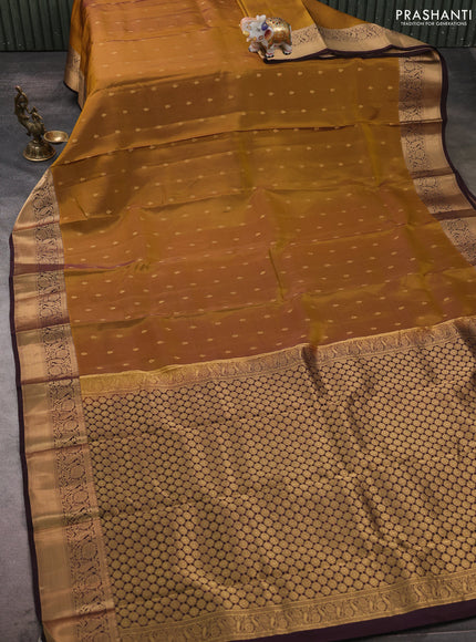 Kanchipuram silk saree dark mustard and coffee brown with allover zari woven buttas and zari woven border