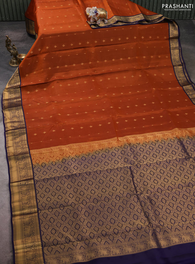 Kanchipuram silk saree rustic orange and navy blue with allover zari woven buttas and zari woven border