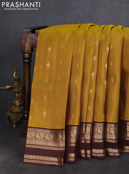 Kanchipuram silk saree mehendi green and coffee brown with allover zari woven buttas and rettapet zari woven border