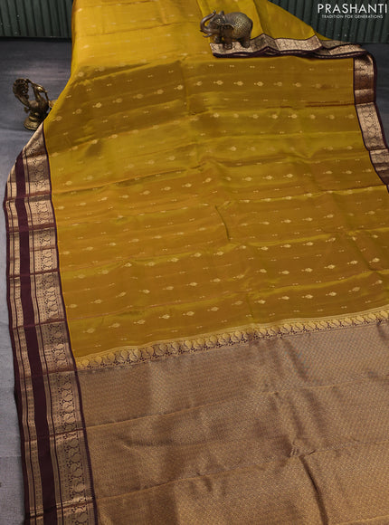 Kanchipuram silk saree mehendi green and coffee brown with allover zari woven buttas and rettapet zari woven border