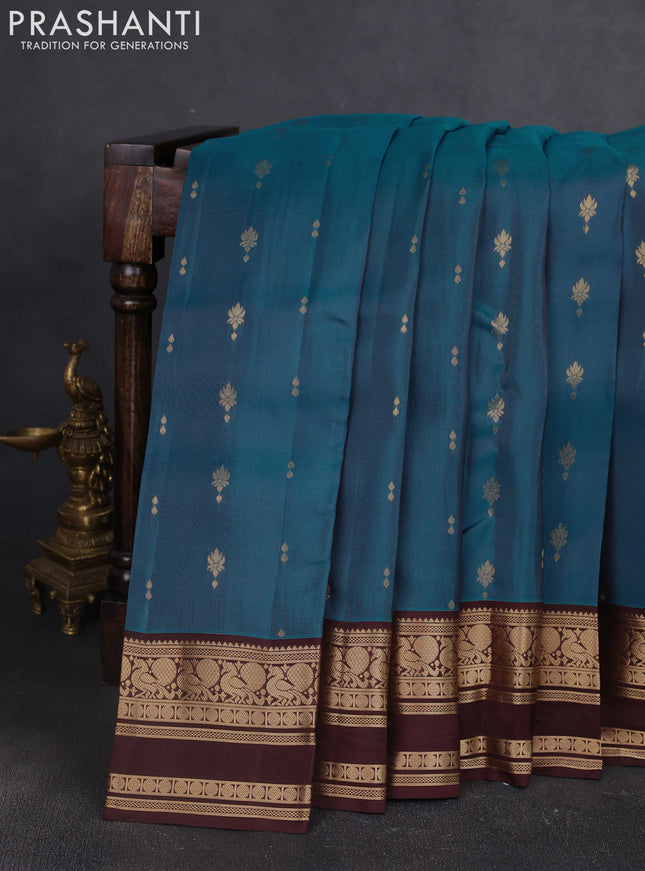 Kanchipuram silk saree peacock green and coffee brown with allover zari woven buttas and rettapet zari woven border
