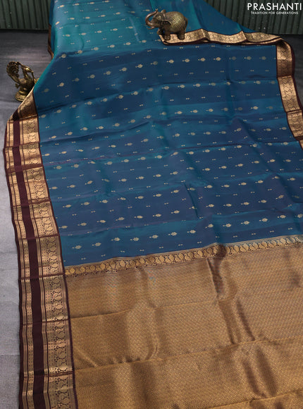 Kanchipuram silk saree peacock green and coffee brown with allover zari woven buttas and rettapet zari woven border