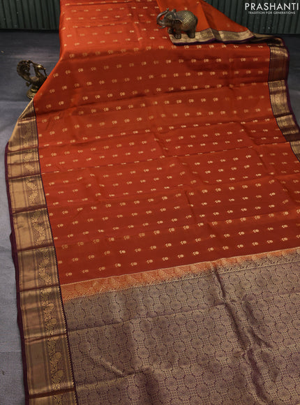 Kanchipuram silk saree rustic orange and wine shade with allover zari woven buttas and zari woven border