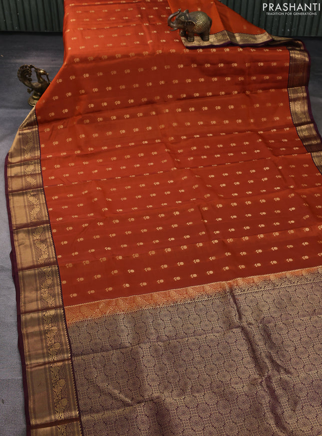 Kanchipuram silk saree rustic orange and wine shade with allover zari woven buttas and zari woven border