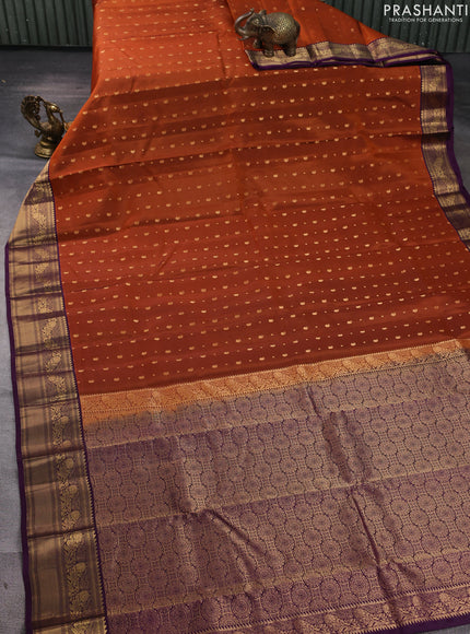 Kanchipuram silk saree rustic orange and purple with allover zari woven buttas and zari woven border