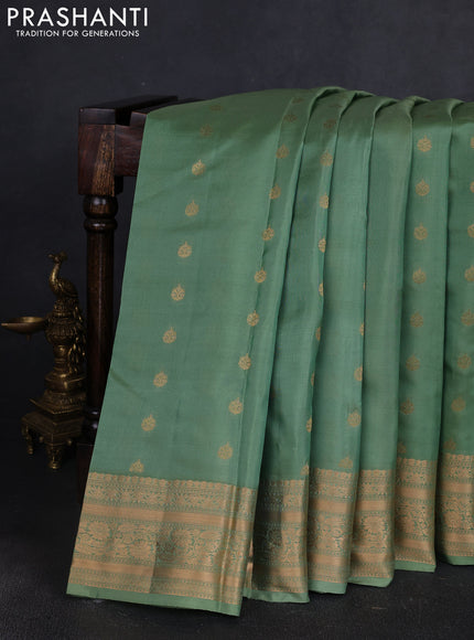 Kanchipuram silk saree pastel green with allover zari woven buttas and zari woven border