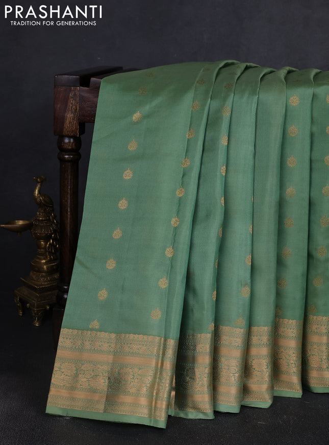 Kanchipuram silk saree pastel green with allover zari woven buttas and zari woven border