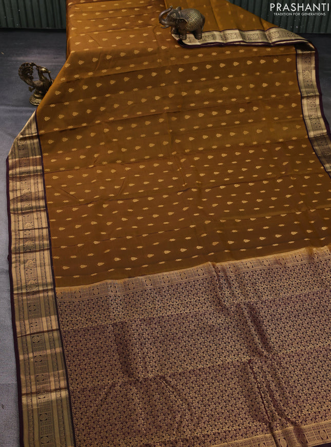 Kanchipuram silk saree dark mustard and wine shade with allover zari woven buttas and zari woven border