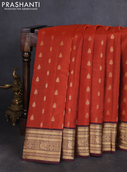 Kanchipuram silk saree rustic orange and wine shade with allover zari woven buttas and zari woven border