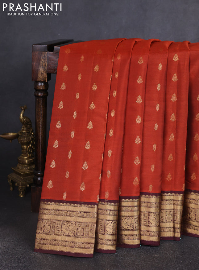 Kanchipuram silk saree rustic orange and wine shade with allover zari woven buttas and zari woven border