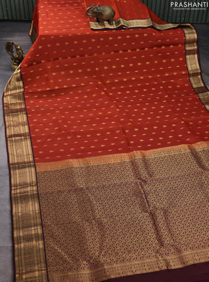 Kanchipuram silk saree rustic orange and wine shade with allover zari woven buttas and zari woven border