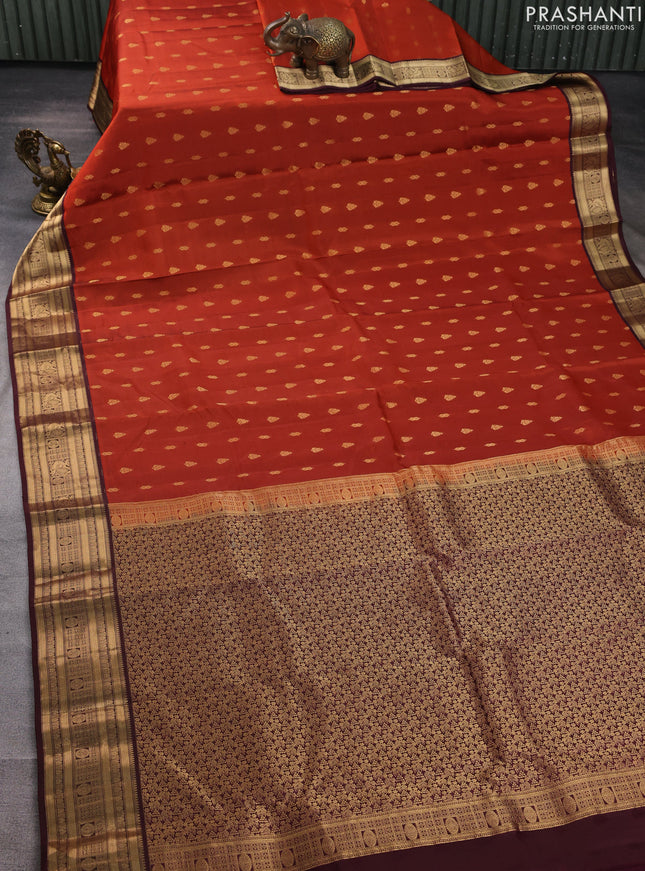 Kanchipuram silk saree rustic orange and wine shade with allover zari woven buttas and zari woven border