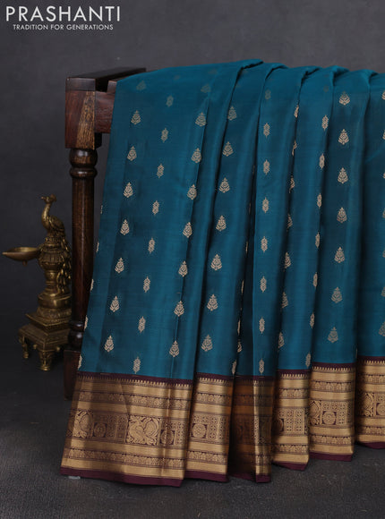 Kanchipuram silk saree peacock green and wine shade with allover zari woven buttas and zari woven border