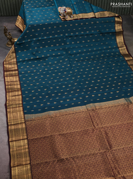 Kanchipuram silk saree peacock green and wine shade with allover zari woven buttas and zari woven border