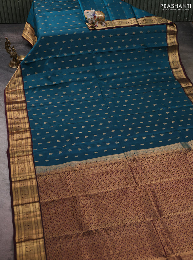 Kanchipuram silk saree peacock green and wine shade with allover zari woven buttas and zari woven border