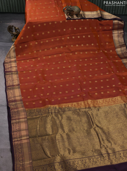 Kanchipuram silk saree rustic orange and coffee brown with allover zari woven buttas and zari woven border