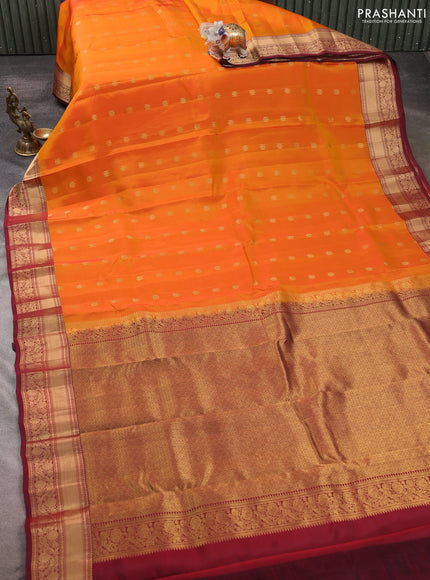 Kanchipuram silk saree orange and deep maroon with allover zari woven buttas and zari woven border