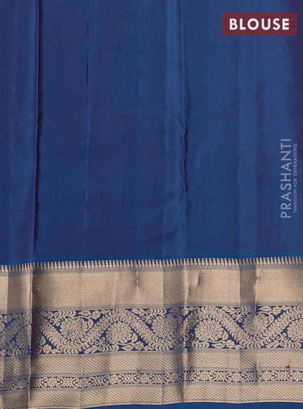 Kanchipuram silk saree rustic orange and peacock blue with allover zari woven buttas and long zari woven border