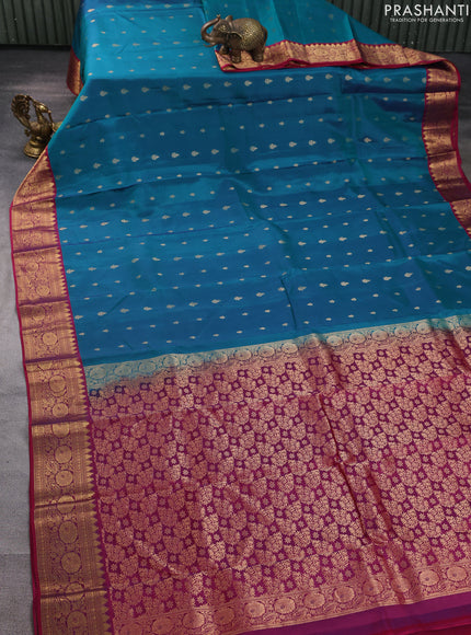 Kanchipuram silk saree peacock green and wine shade with allover zari woven buttas and temple zari woven border
