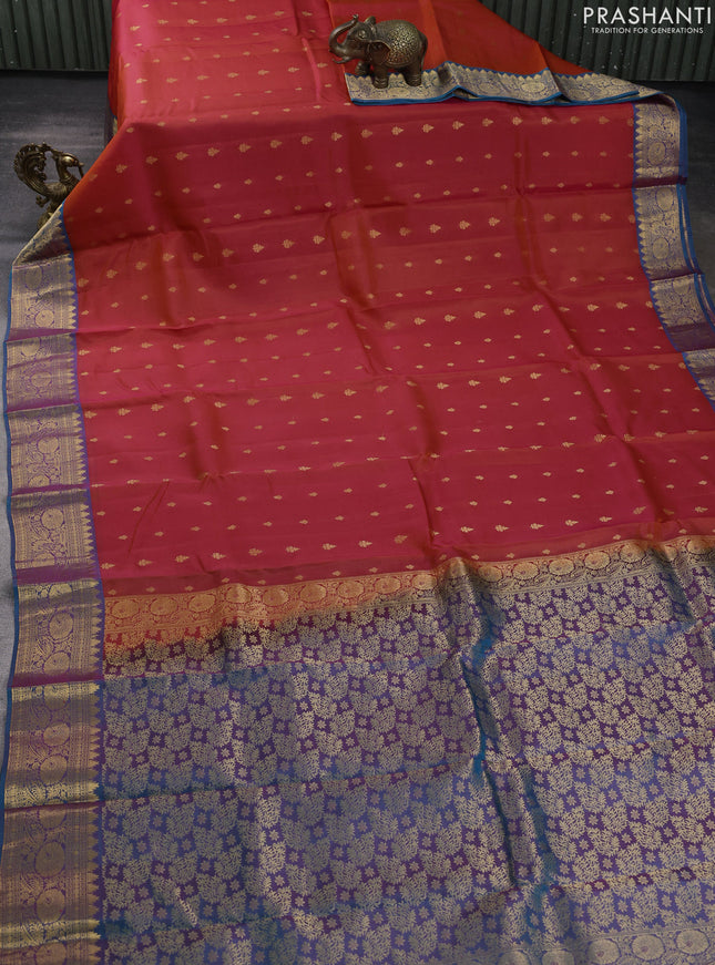 Kanchipuram silk saree orange and peacock green with allover zari woven buttas and zari woven border