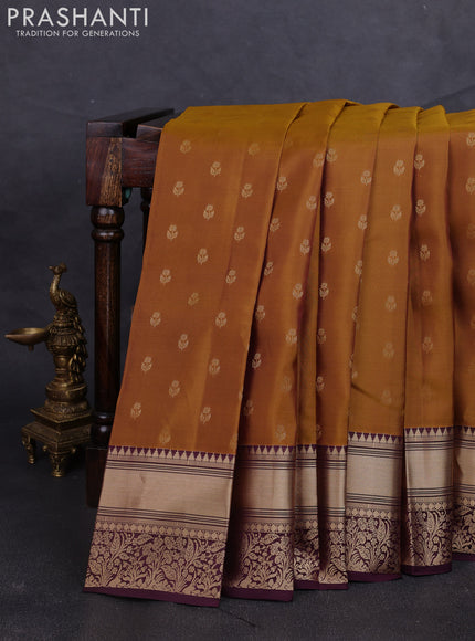 Kanchipuram silk saree dark mustard and wine shade with allover zari woven buttas and rich zari woven border