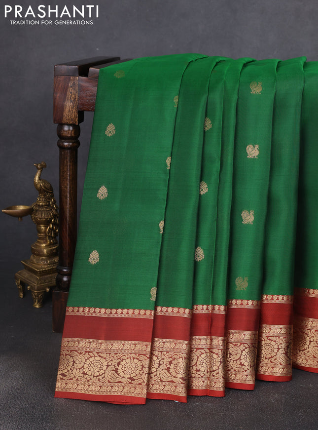 Kanchipuram silk saree green and rust shade with allover zari woven buttas and rettapet zari woven border