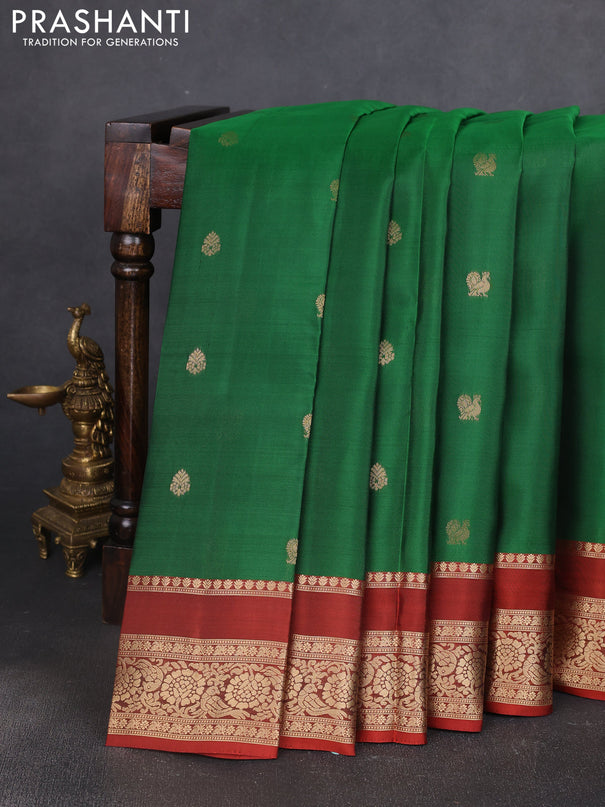 Kanchipuram silk saree green and rust shade with allover zari woven buttas and rettapet zari woven border