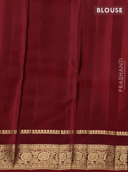 Kanchipuram silk saree elachi green and maroon with allover zari woven buttas and rettapet zari woven border