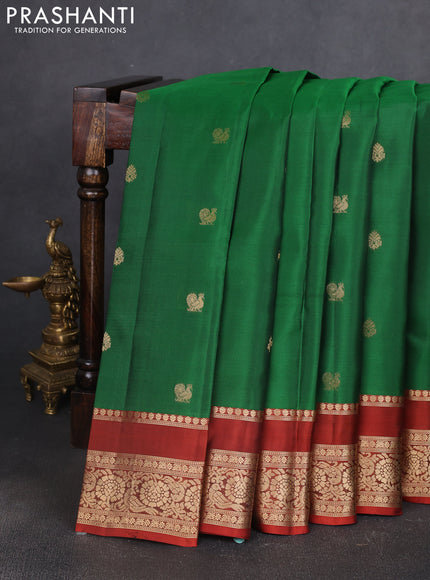 Kanchipuram silk saree green and rust shade with allover zari woven buttas and rettapet zari woven border
