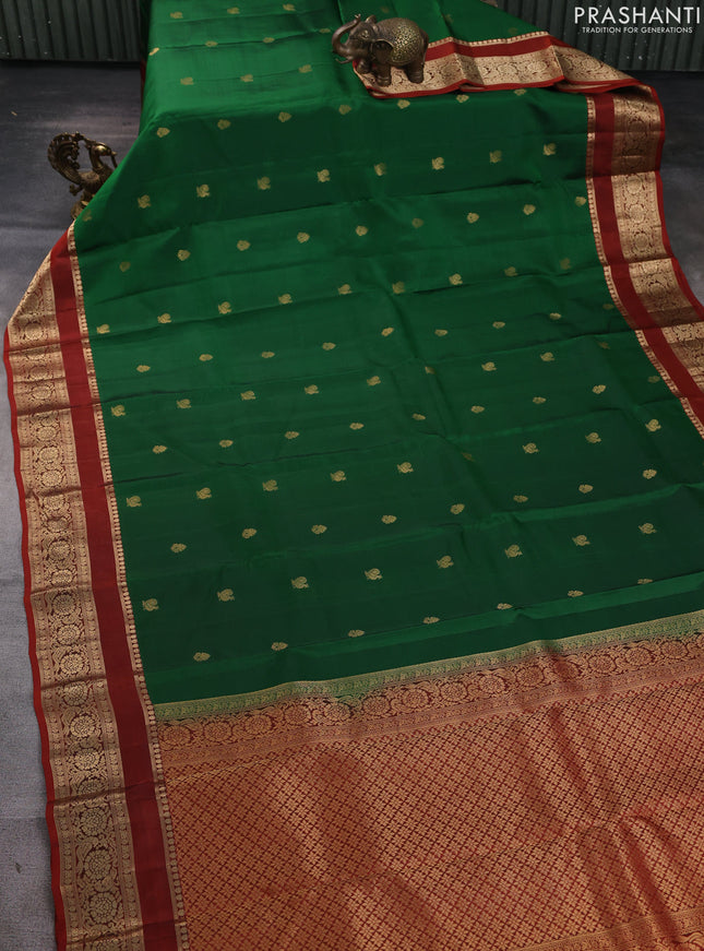 Kanchipuram silk saree green and rust shade with allover zari woven buttas and rettapet zari woven border