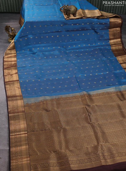 Kanchipuram silk saree peacock blue and coffee brown with allover zari woven buttas and zari woven border