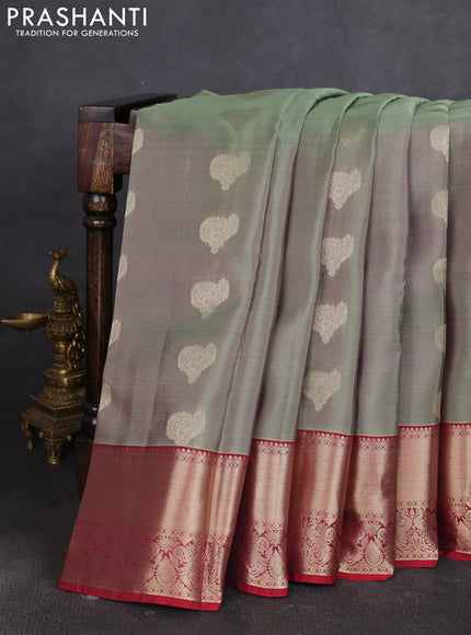 Kanchipuram silk saree dual shade of green shade and maroon with allover zari woven buttas and zari woven border