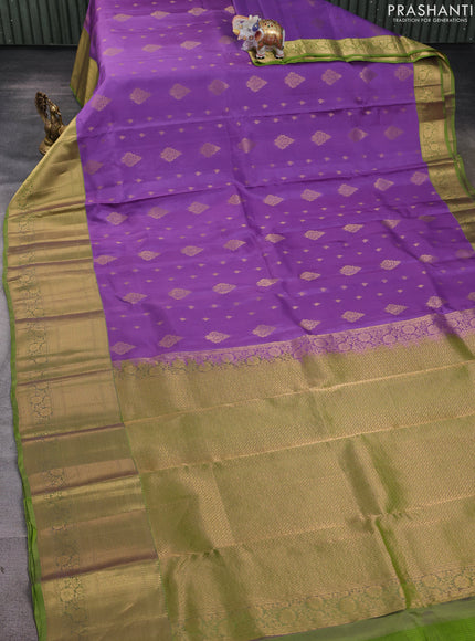 Kanchipuram silk saree lavender and light green with allover zari woven buttas and long zari woven border