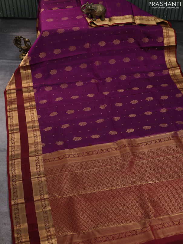 Kanchipuram silk saree wine shade and maroon with allover zari woven buttas and rettapet zari woven border